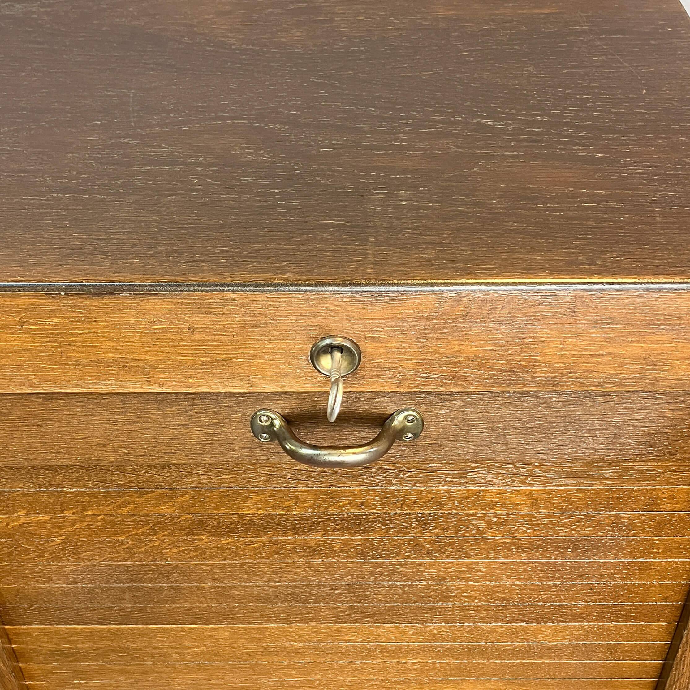 Roller shutter cabinet, dark oak, 1950s