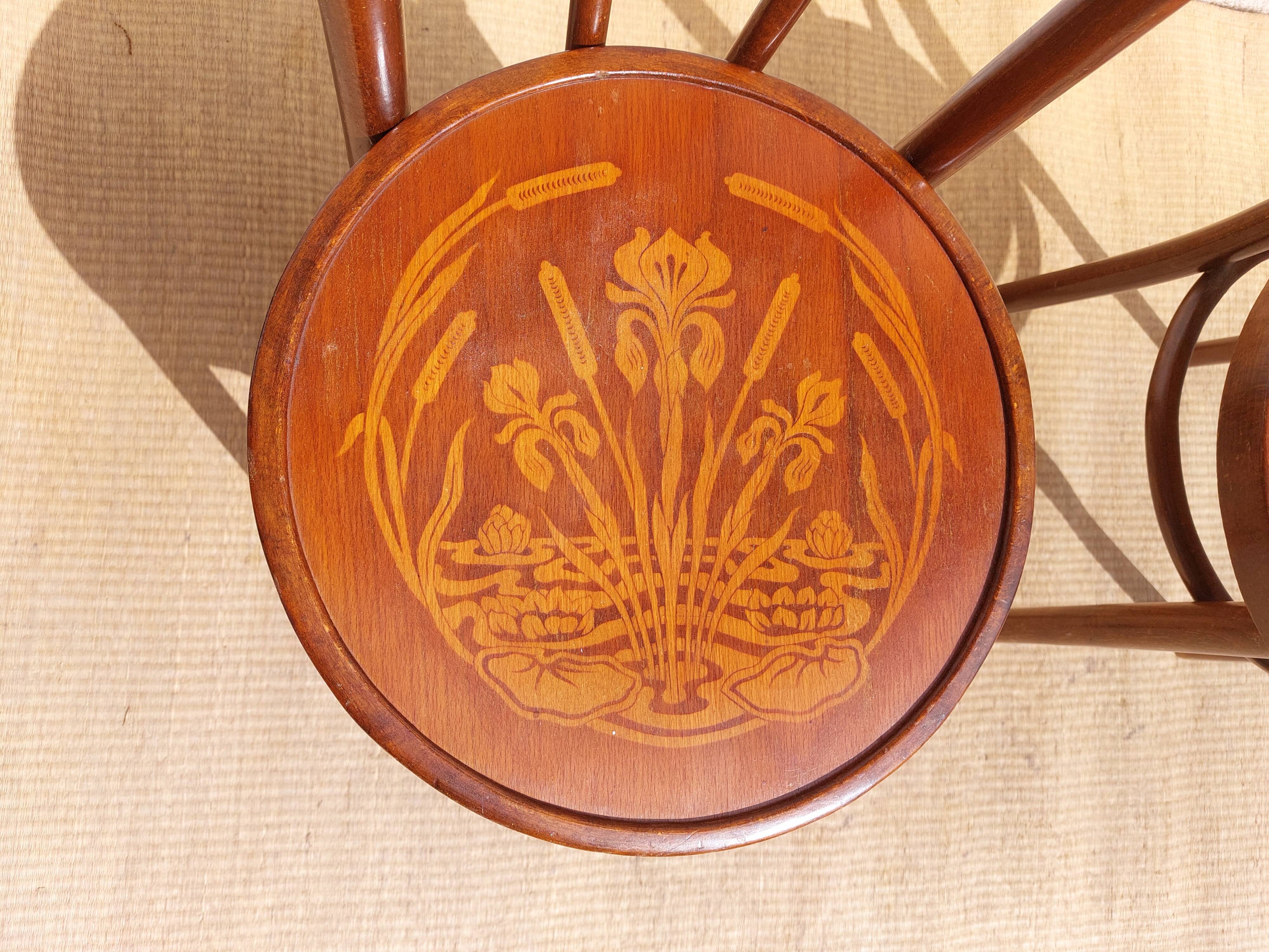 pair of bistro chairs, curved wood and pattern on the seat