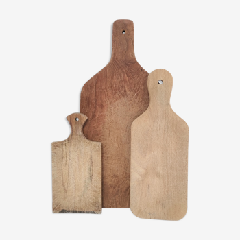 Three vintage patinated solid wood cutting boards