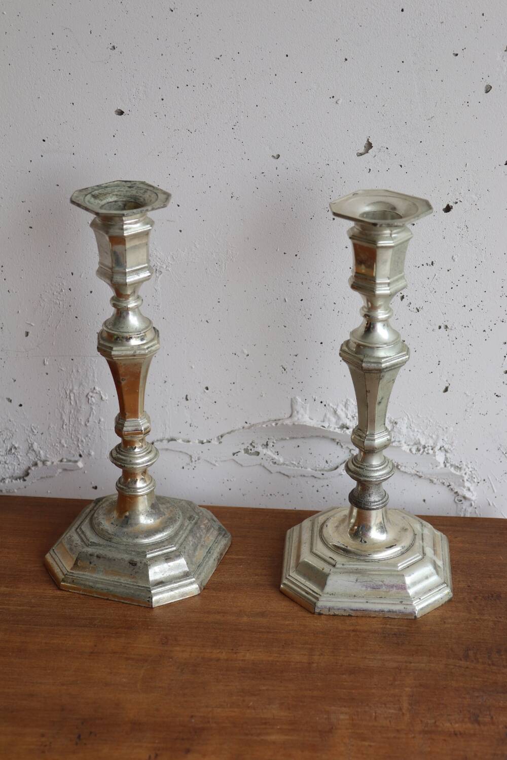 Pair of antique silver-plated metal candlesticks