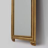 20th Century gilded wooden Empire style mirror with eagle on top