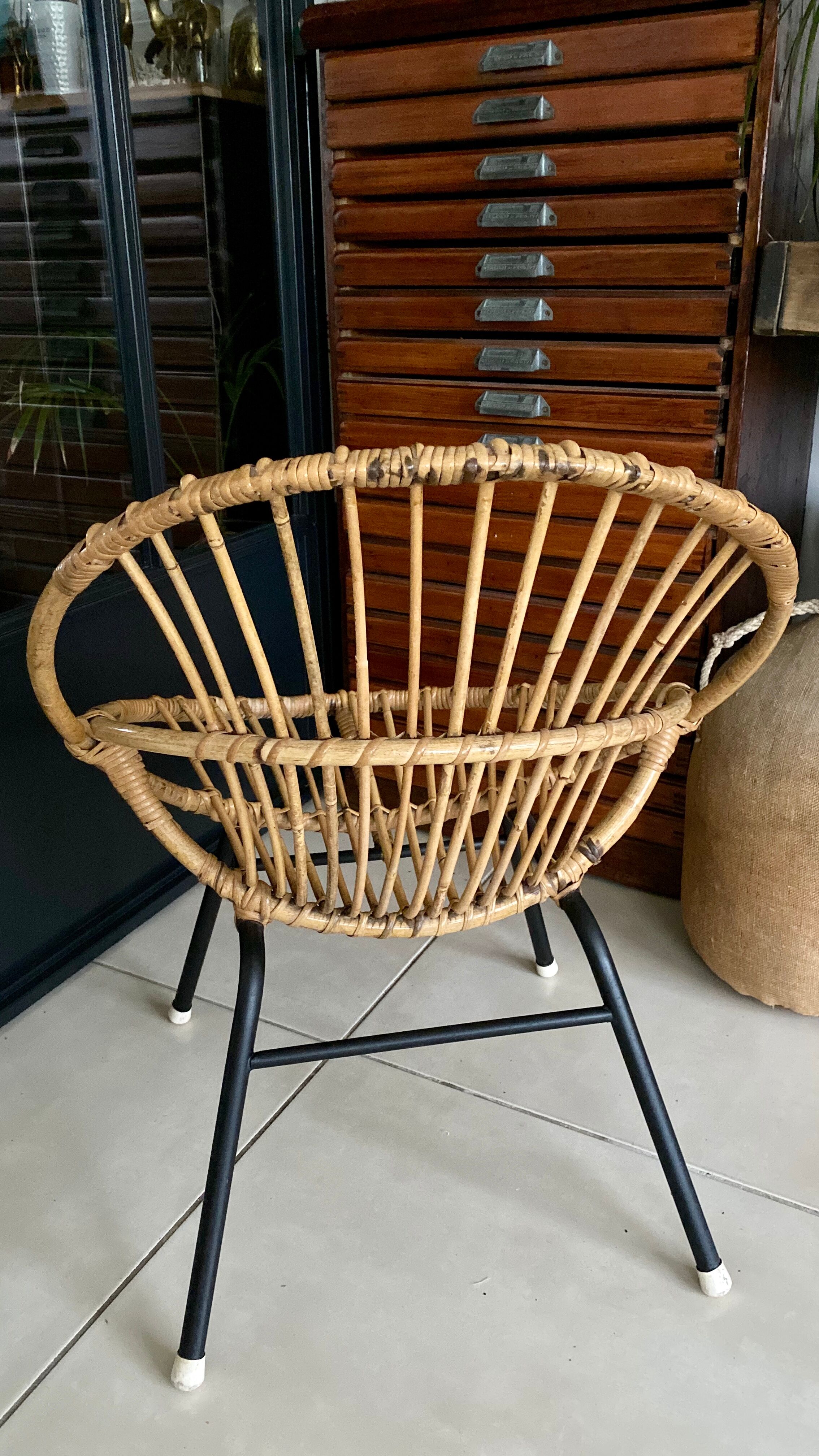 Old vintage metal foot rattan chair