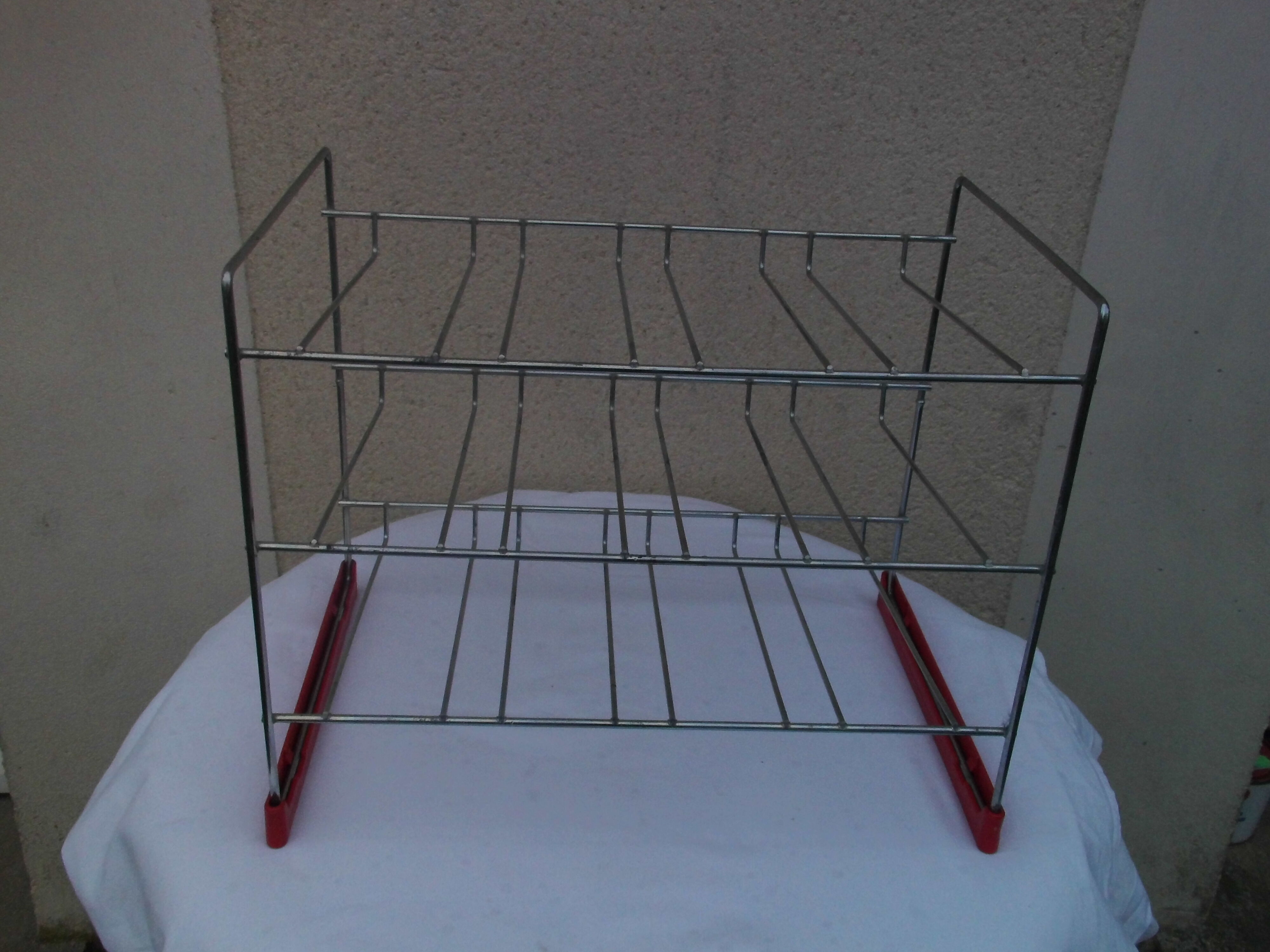 Former metal shopping cart shelf