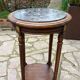 Old wooden pedestal table with marble top