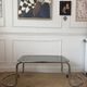Table basse en métal et verre fumé 1970