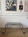 Table basse en métal et verre fumé 1970
