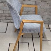 Vintage armchair from the 60s/70s in wood and grey fabric – with armrests.