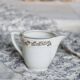 Vintage earthenware milk jug from Moulin des Loups – Gold floral motif