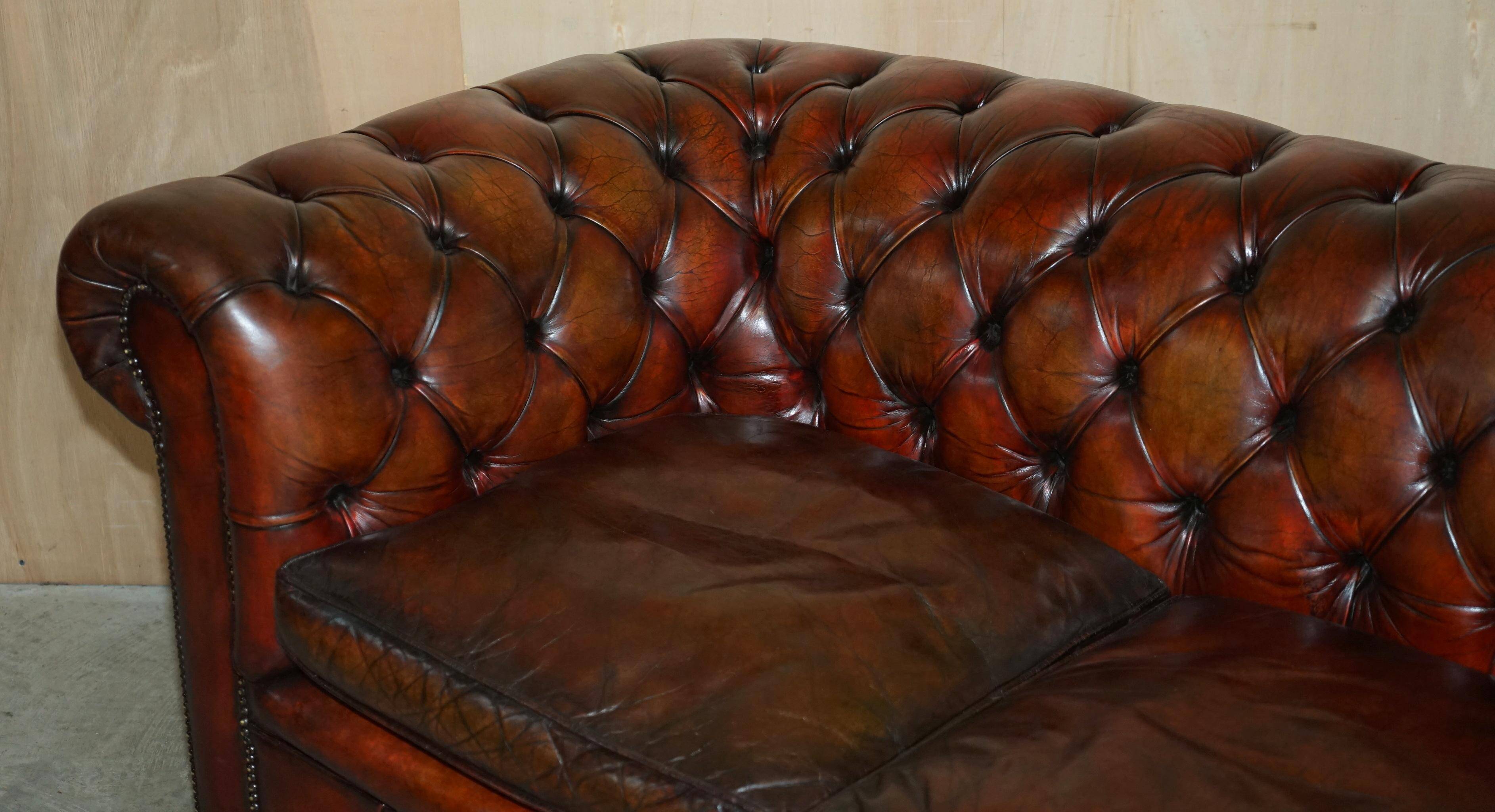 Pair of restored antique Chesterfield sofas in Boudreaux leather.