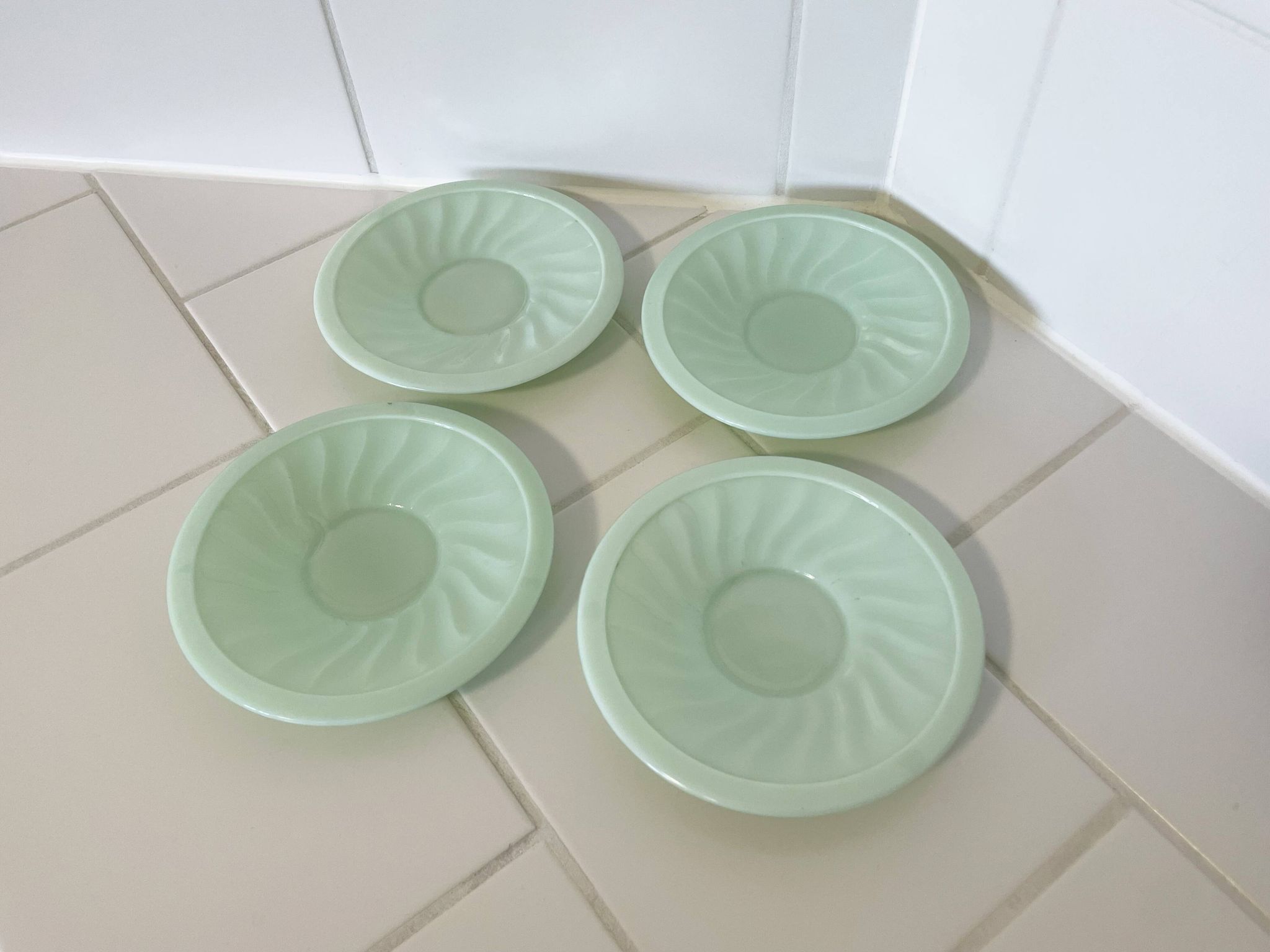 Set of 4 mint green opaline saucers with a swirl pattern, made in France.