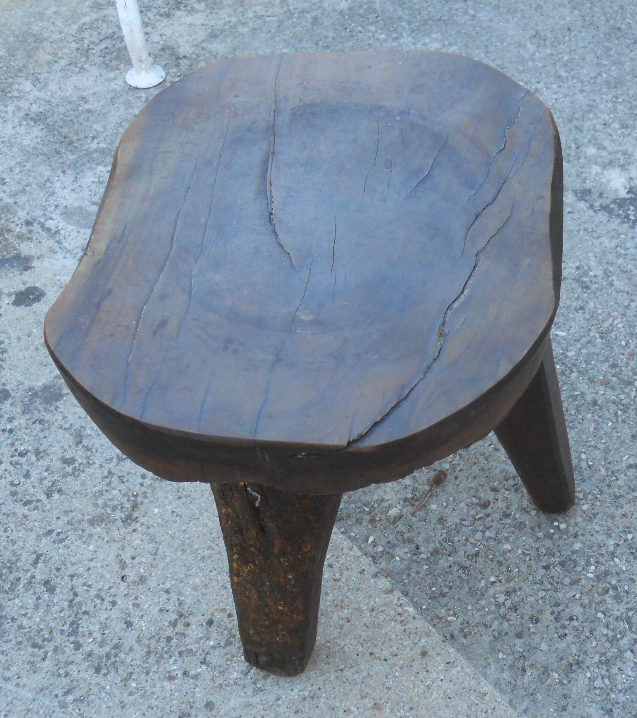 three-legged milking stool made of olive tree folk art