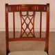 Set of 10 chairs and two mahogany armchairs in Hepplewhite style.