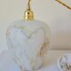Marbled opaline suspension