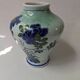 Porcelain vase, Asian art, hand-painted floral decoration.