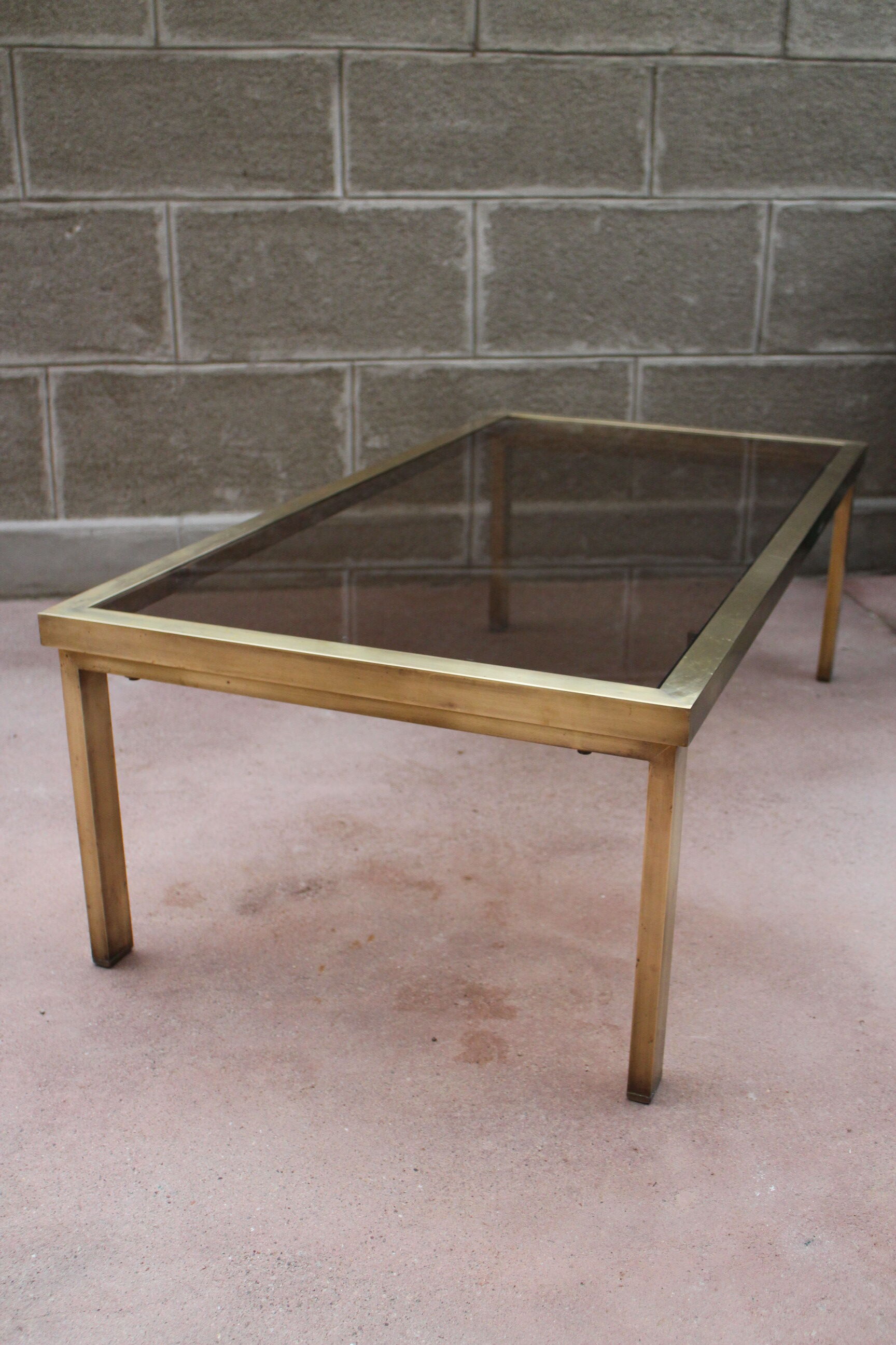 Brass coffee table and 1970 smoked glass