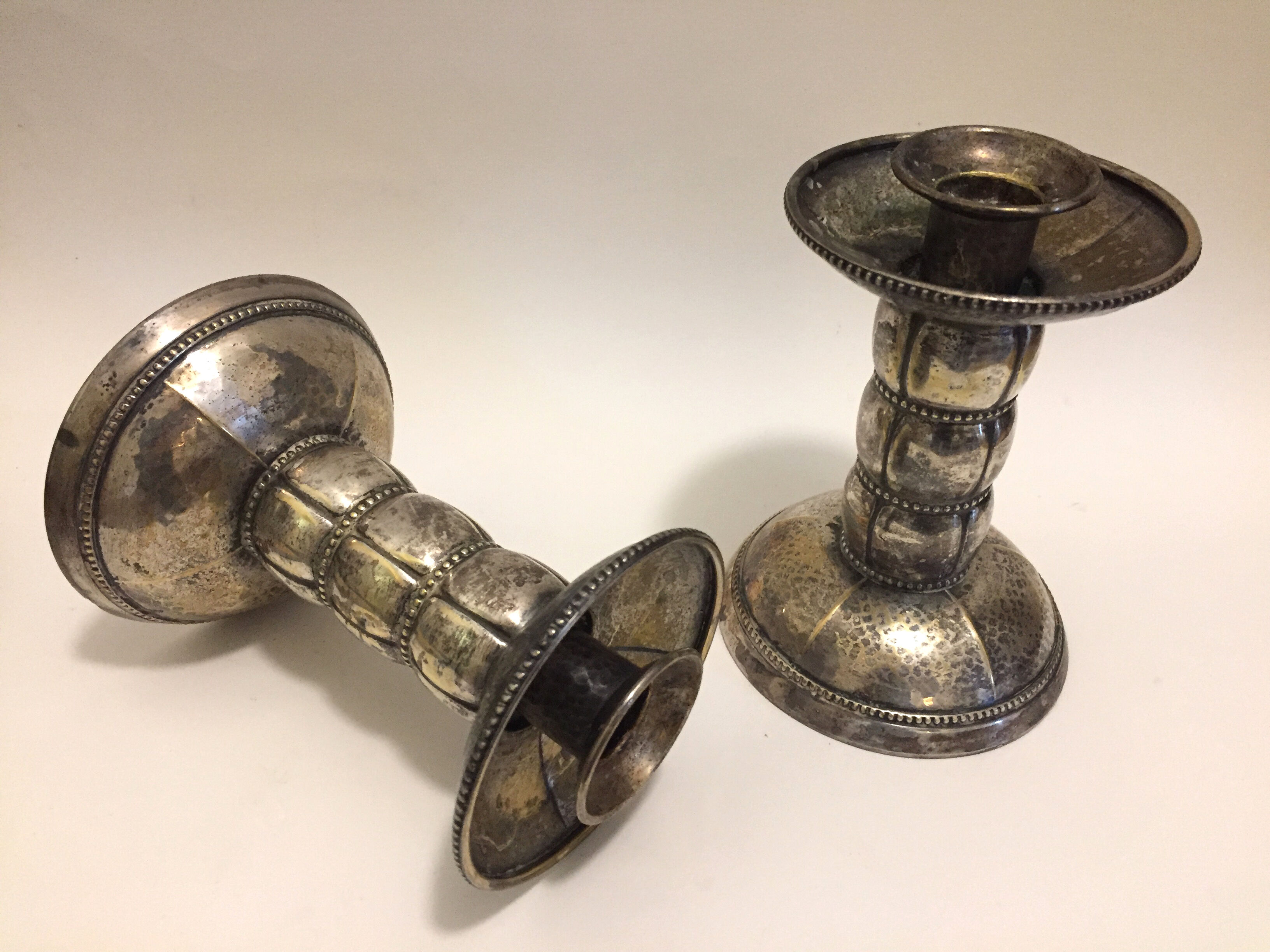 Pair of silver metal candle holders