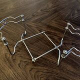 Chrome metal trivet by Tomado Holland