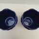 Pair of cache-old pots in midnight blue and gold ceramic