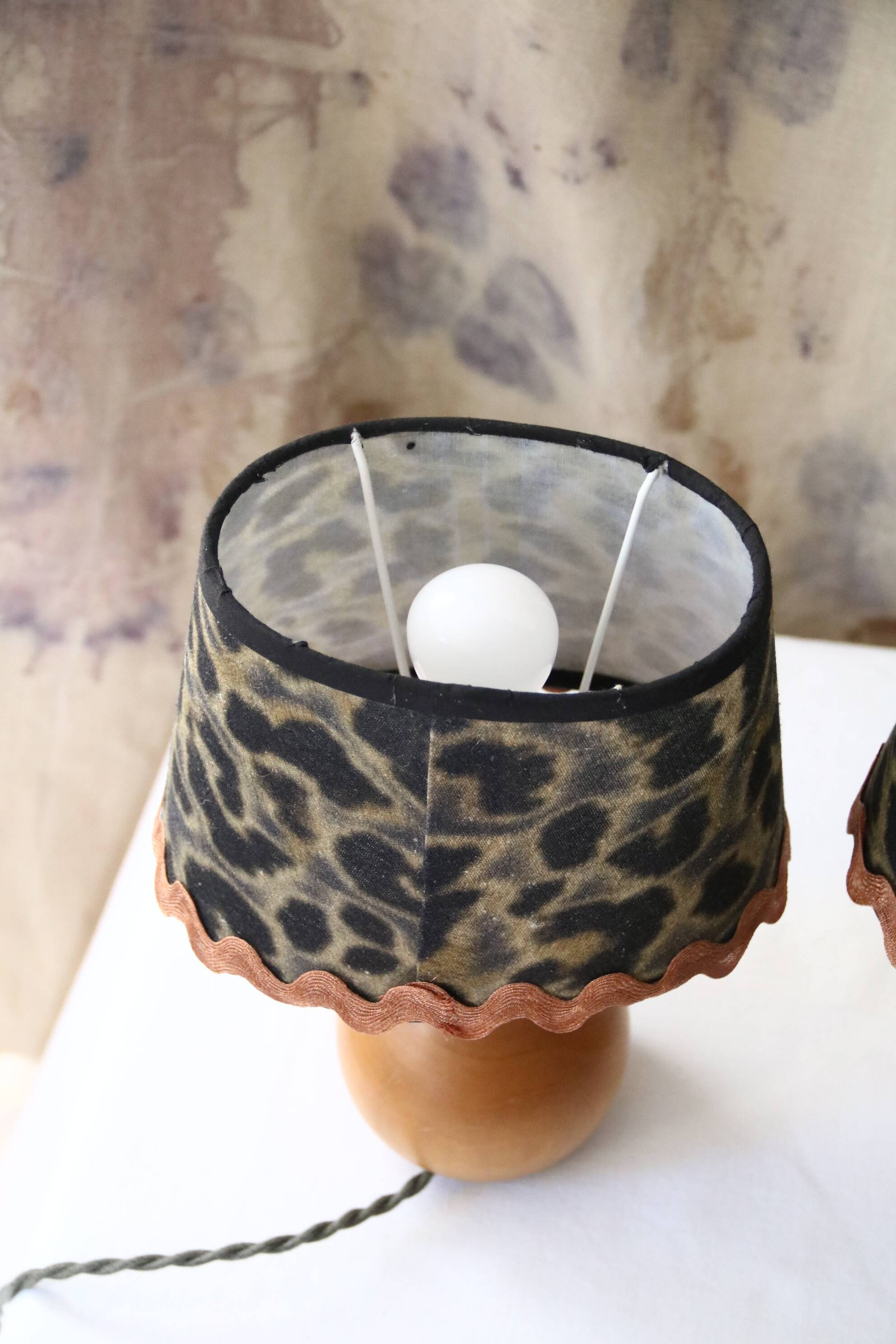 Pair of pear wood bedside lamps with leopard shades