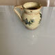 Old ceramic jug with floral decoration