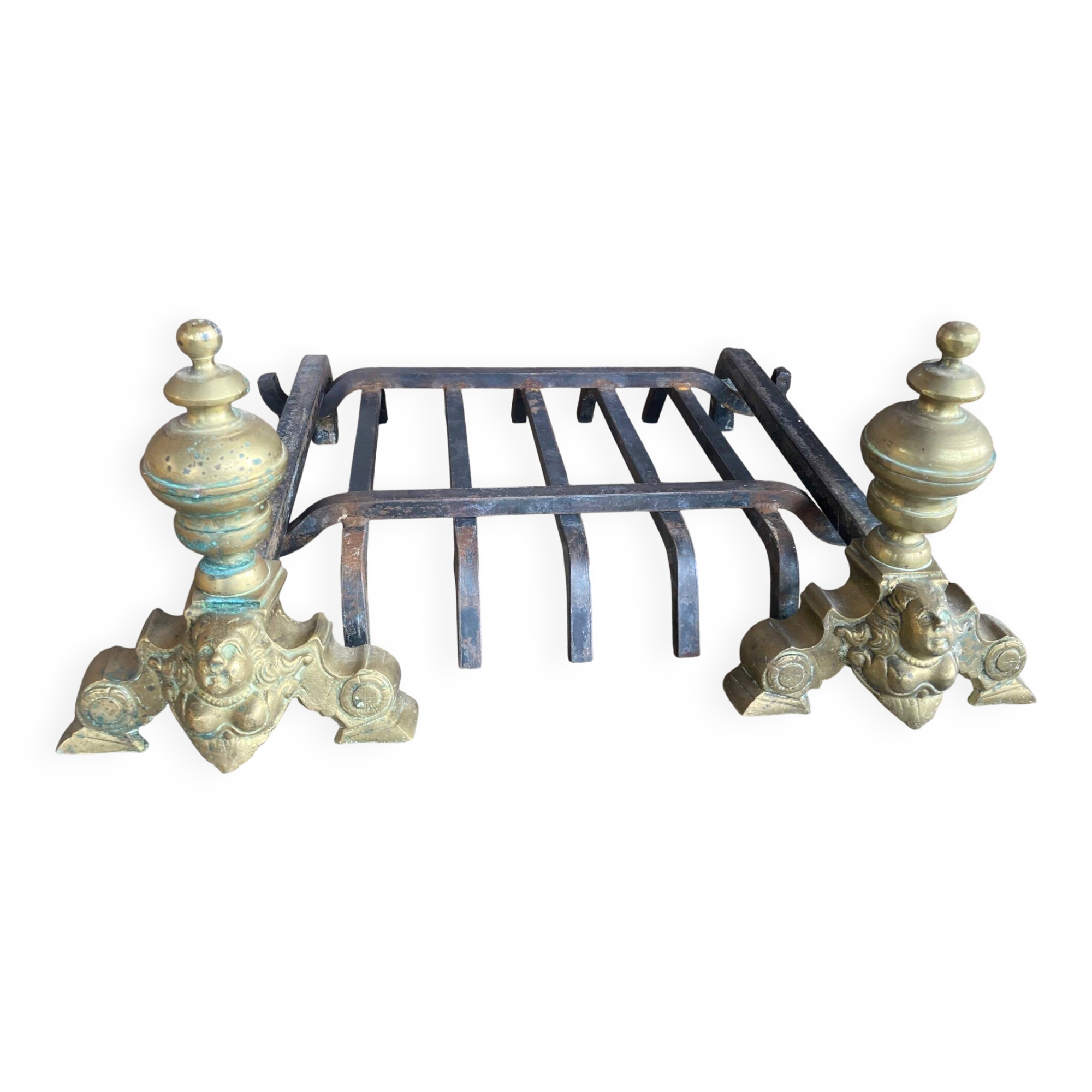 Pair of andirons and grates in cast iron and bronze with gilded grotesques, 17th century