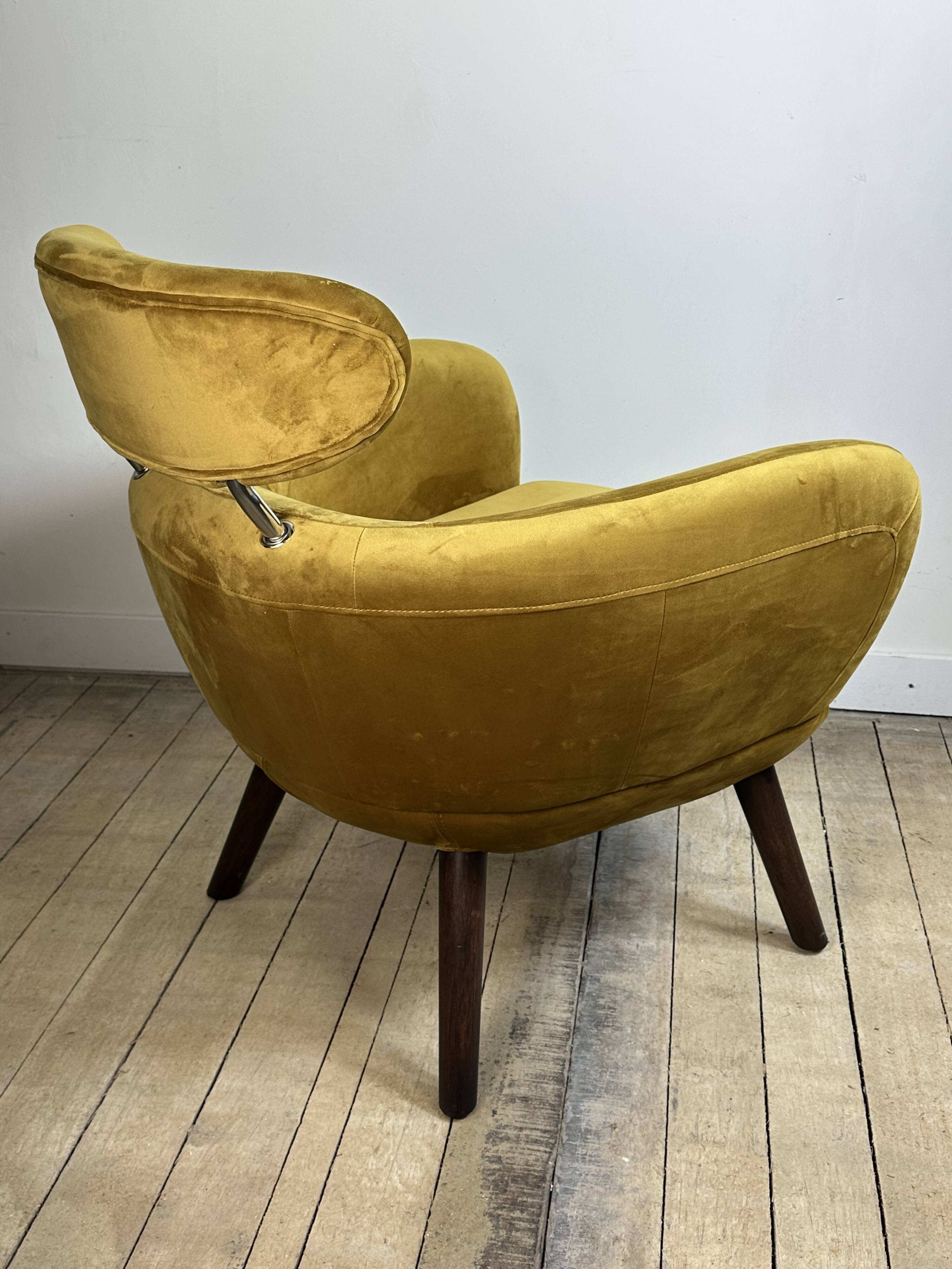Mustard yellow velvet armchair from the 2010s.