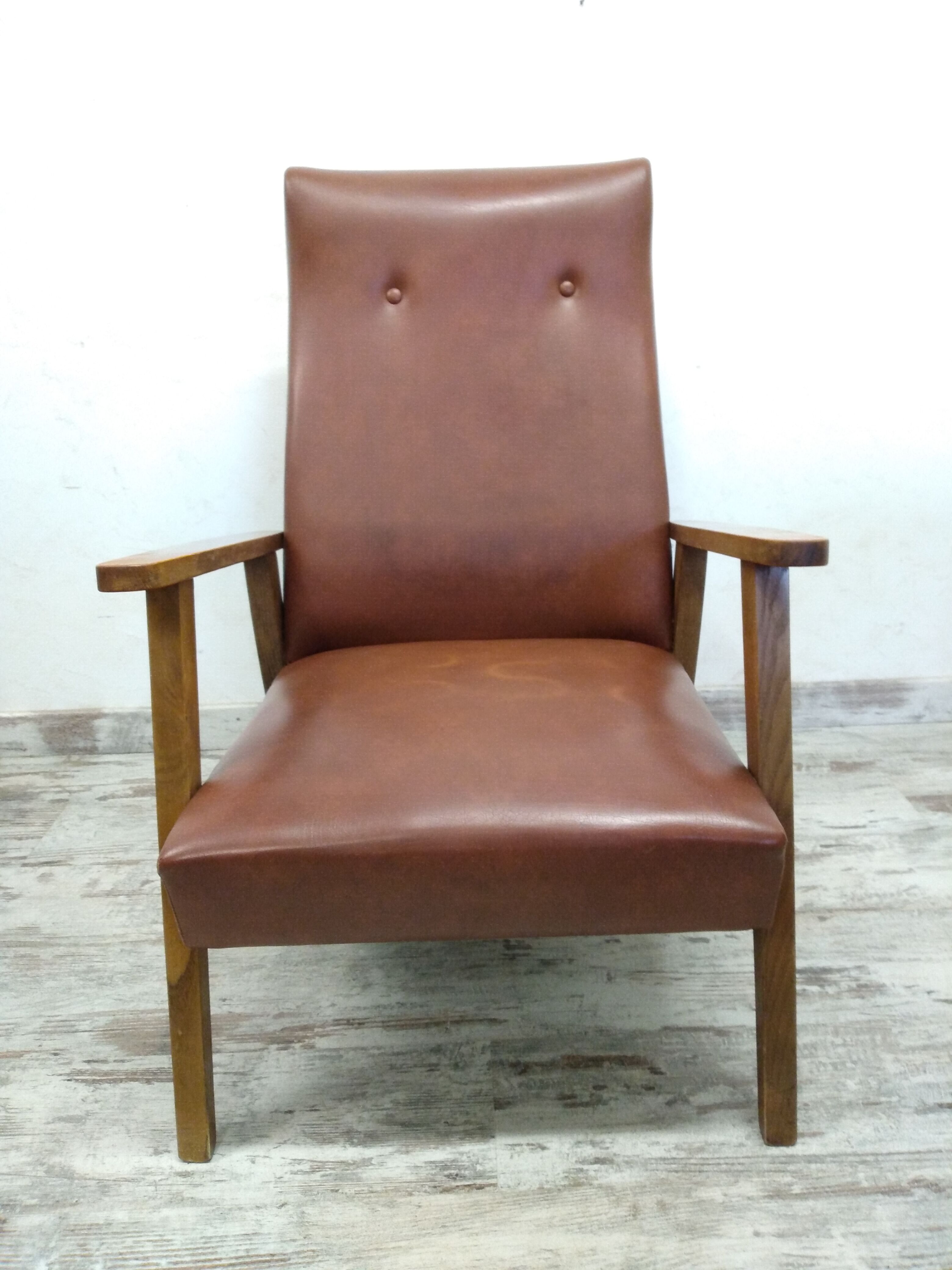 Vintage armchair in wood and imitation leather