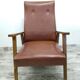 Vintage armchair in wood and imitation leather
