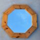 Octagonal pine mirror in 1980s Scandinavian design.