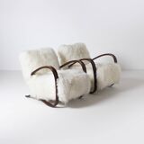 Pair of Jindrich Halabala H 269 lounge chairs in mongolian sheepskin