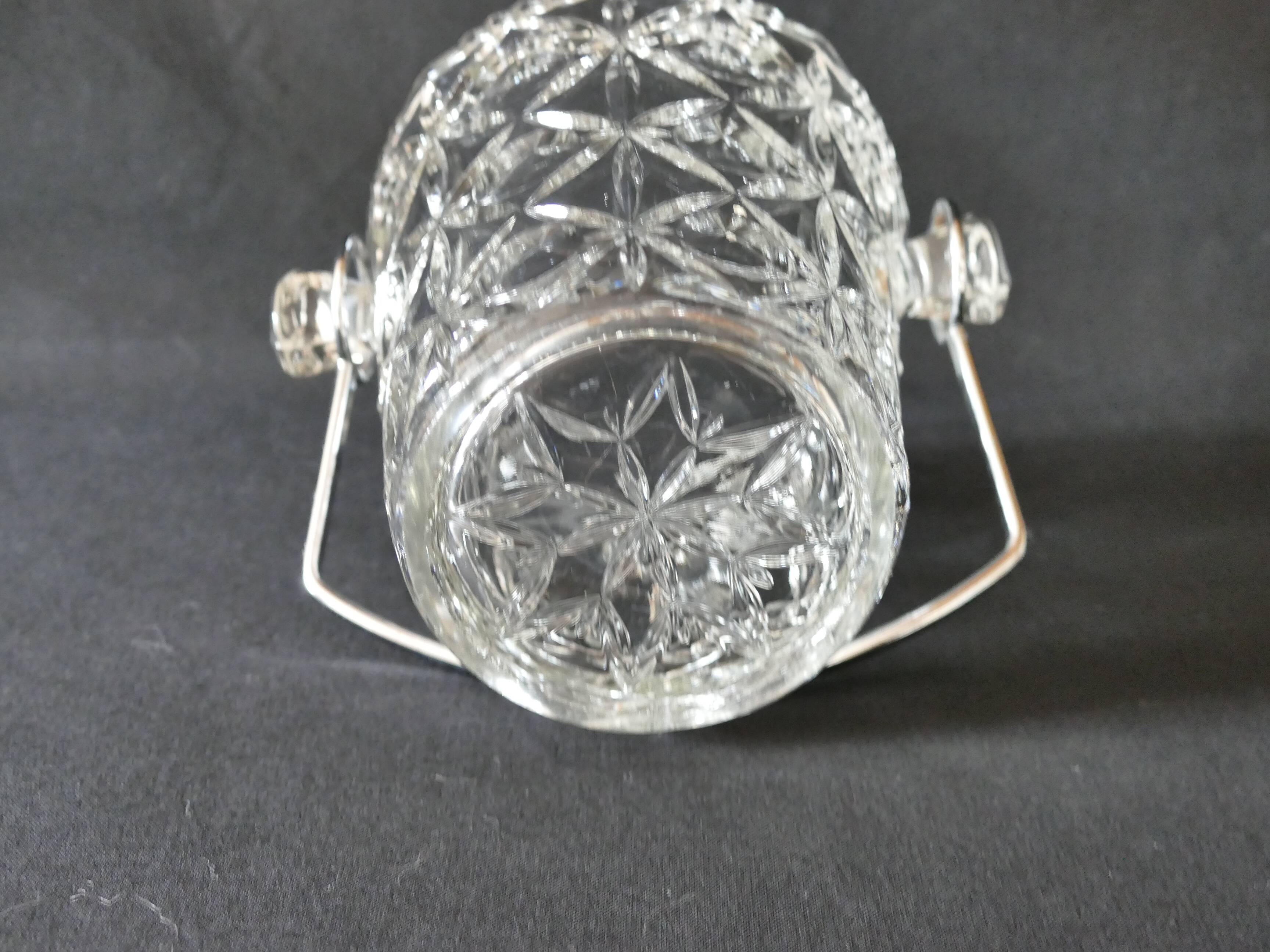 Vintage glass ice bucket stamped with a metal handle