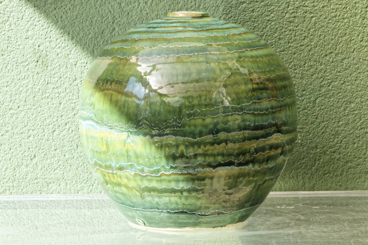 Glazed ceramic ball lamp base, green gradients.