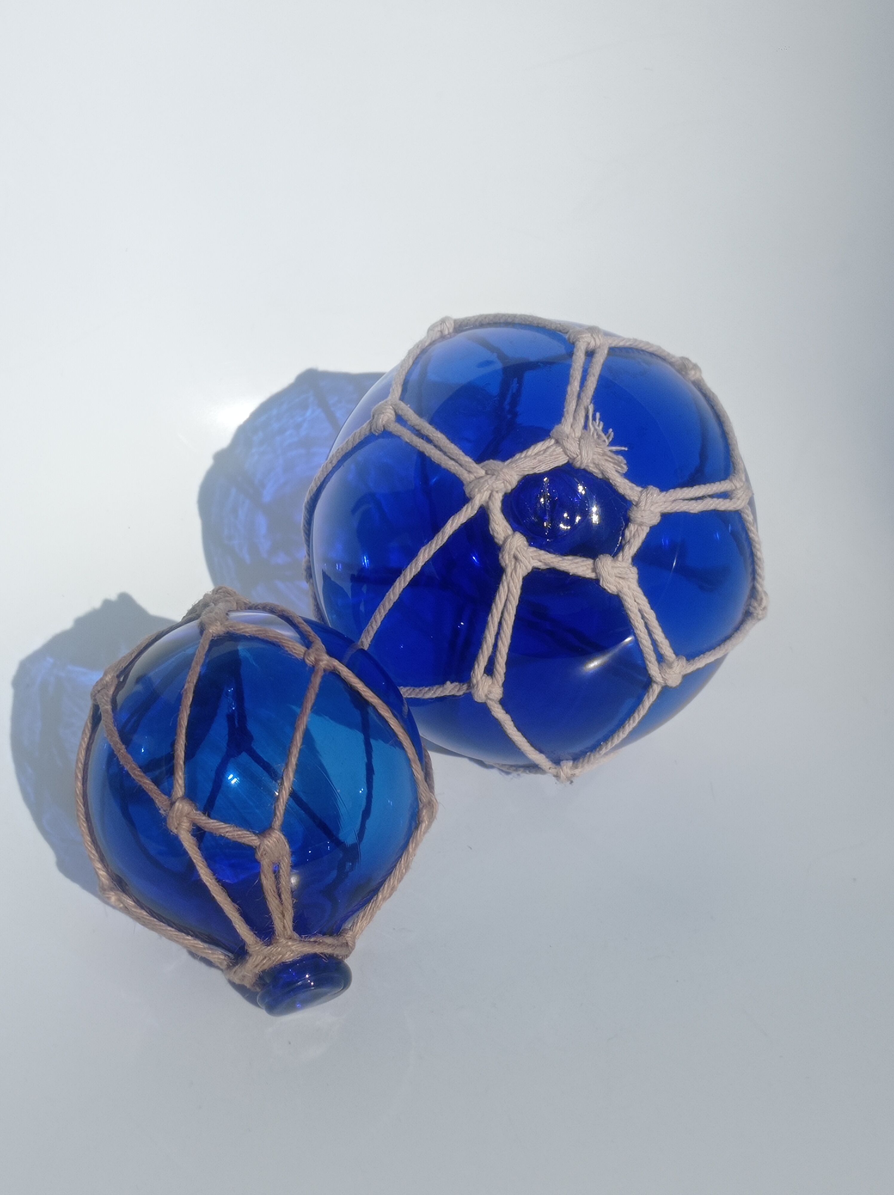 Two blue trawler balls
