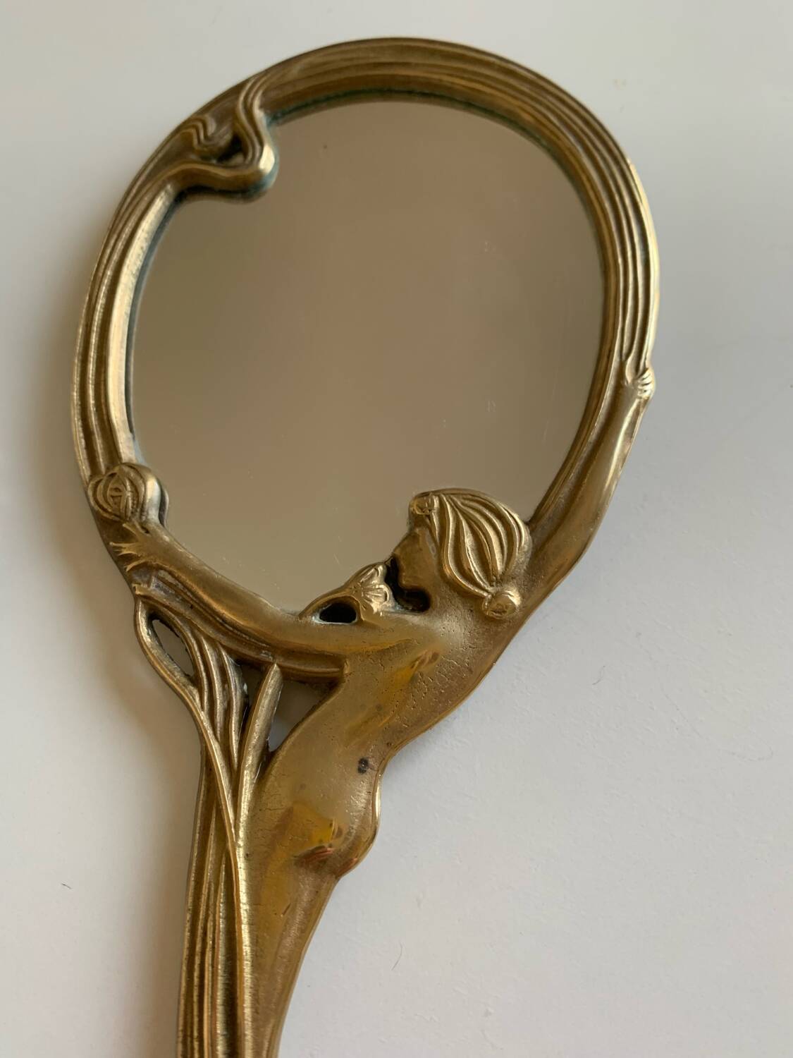 Art Nouveau brass mirror for women