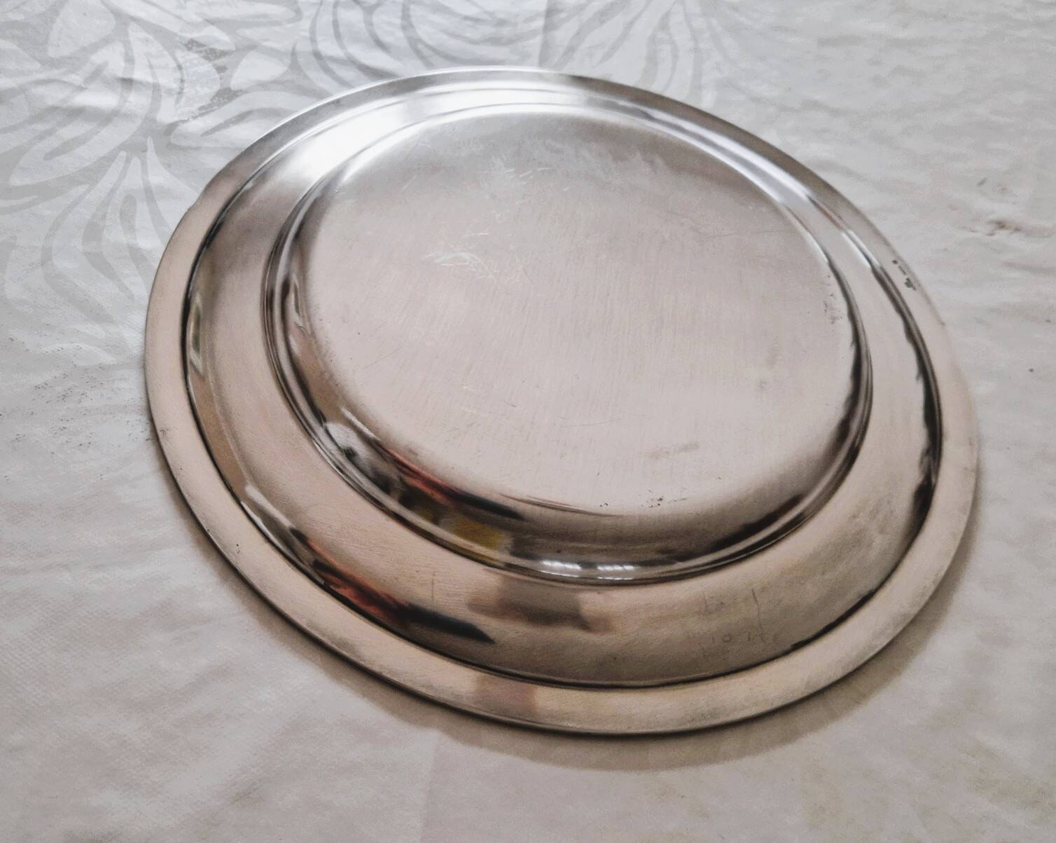 Round silver-plated metal serving dish by Cristofle