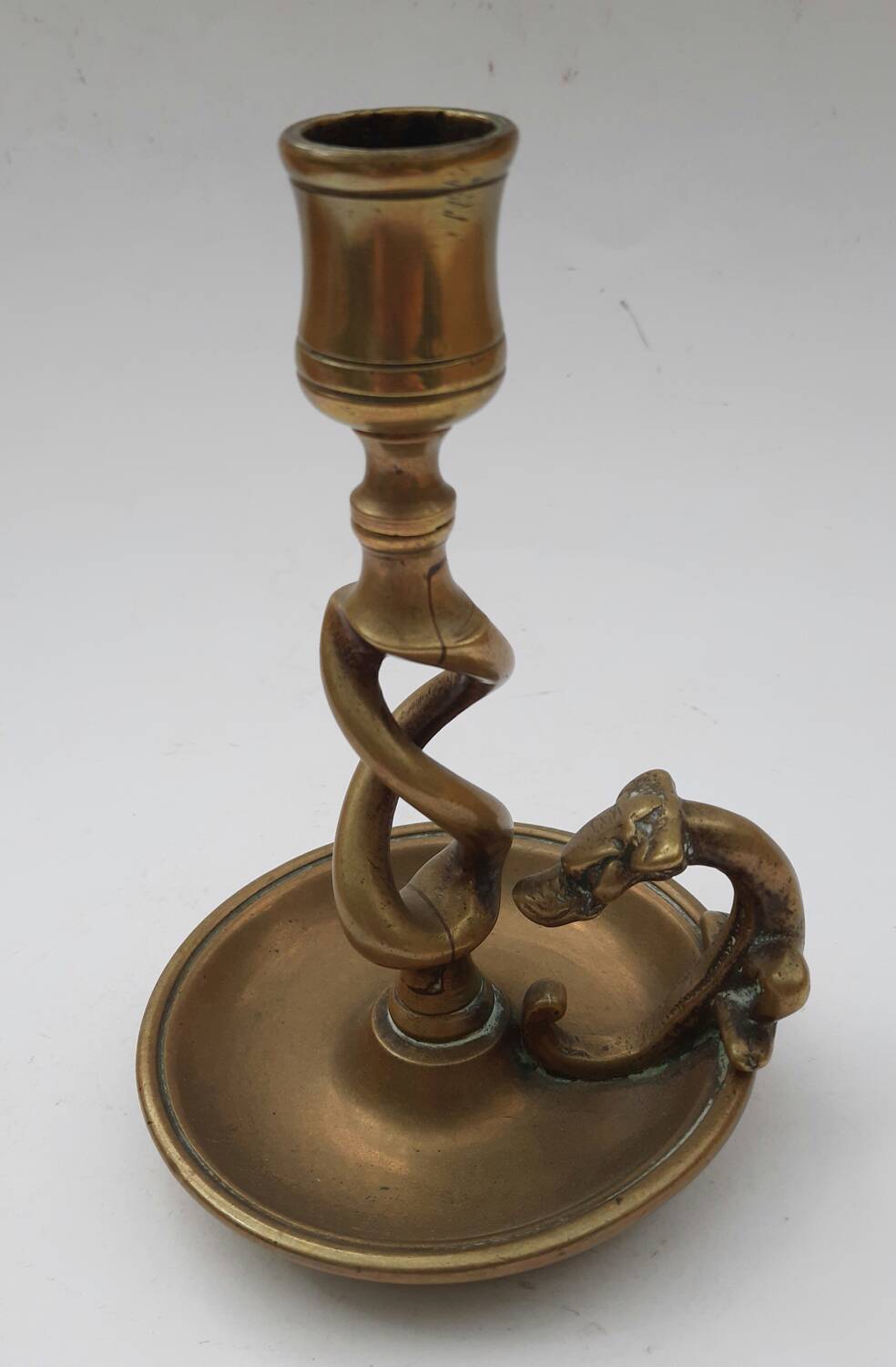 Antique bronze candlestick with dragon-shaped handle from the 17th century