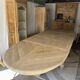 Solid oak farmhouse table with extensions.