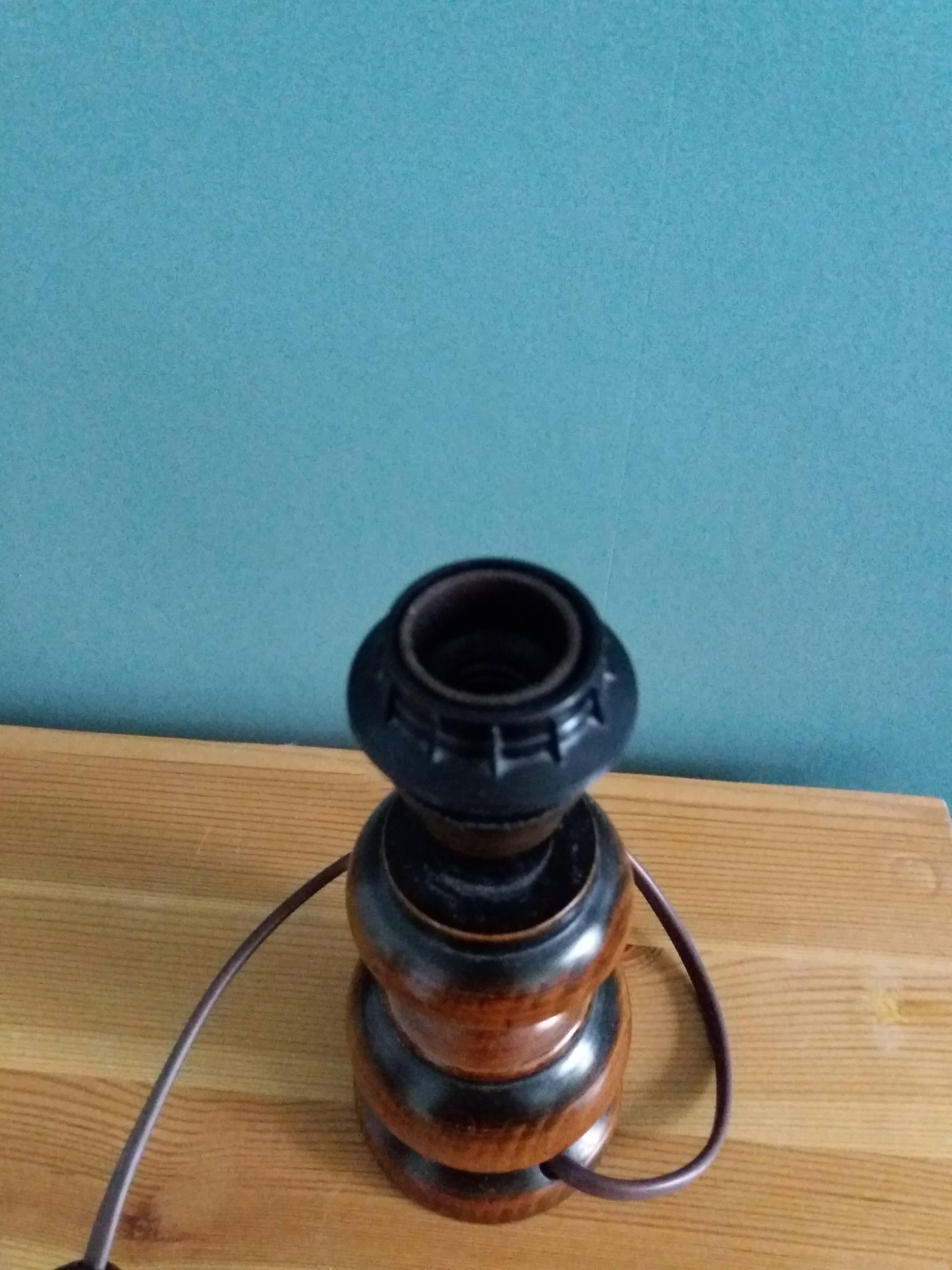 Turned wood bedside lamp with fabric lampshade