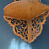 Old wall corner shelf in cut wood from the 1900s