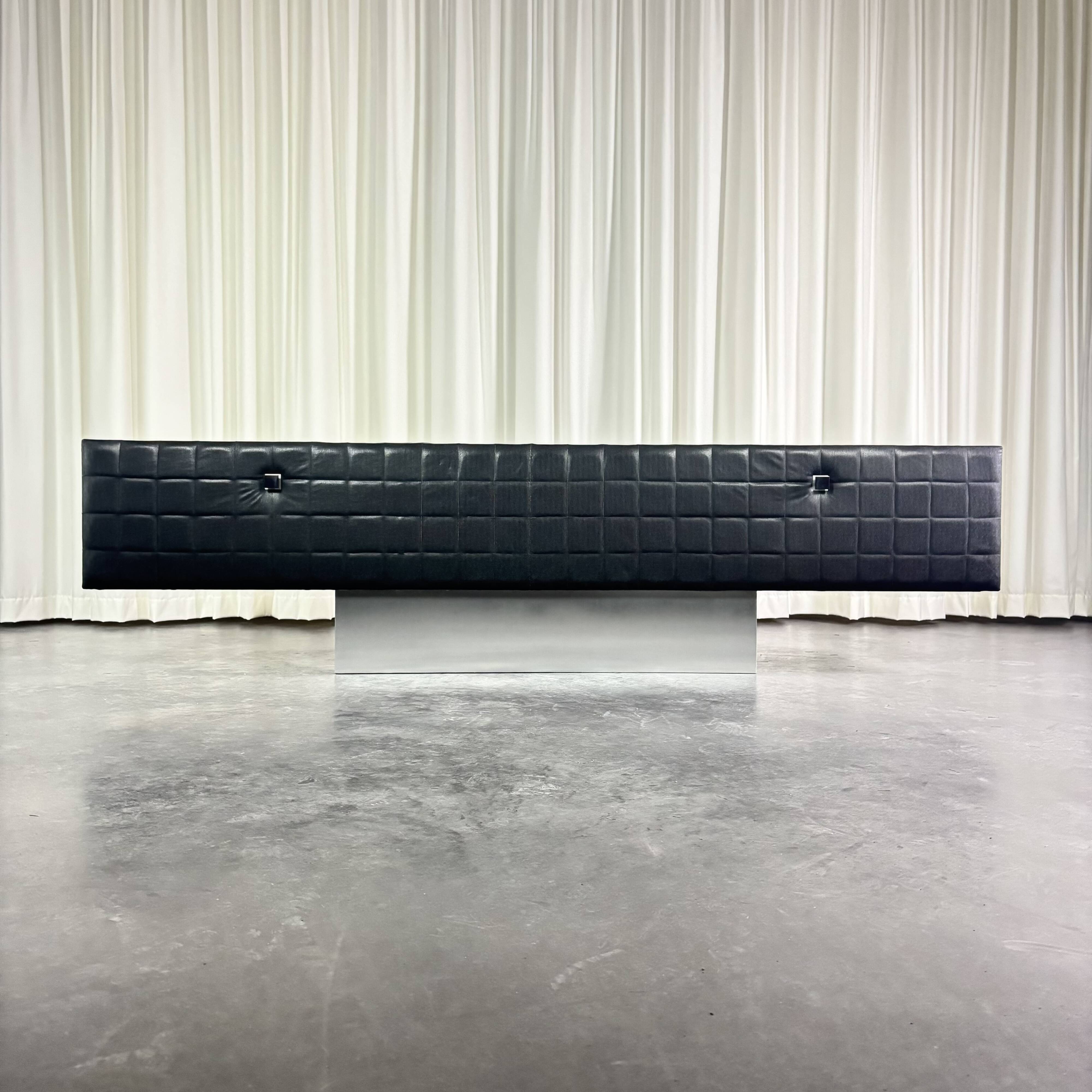 Modernist lowboard, faux leather, wood and stainless steel, 1960.