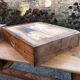 Antique cherry farmhouse table with turned legs and 2 drawers.