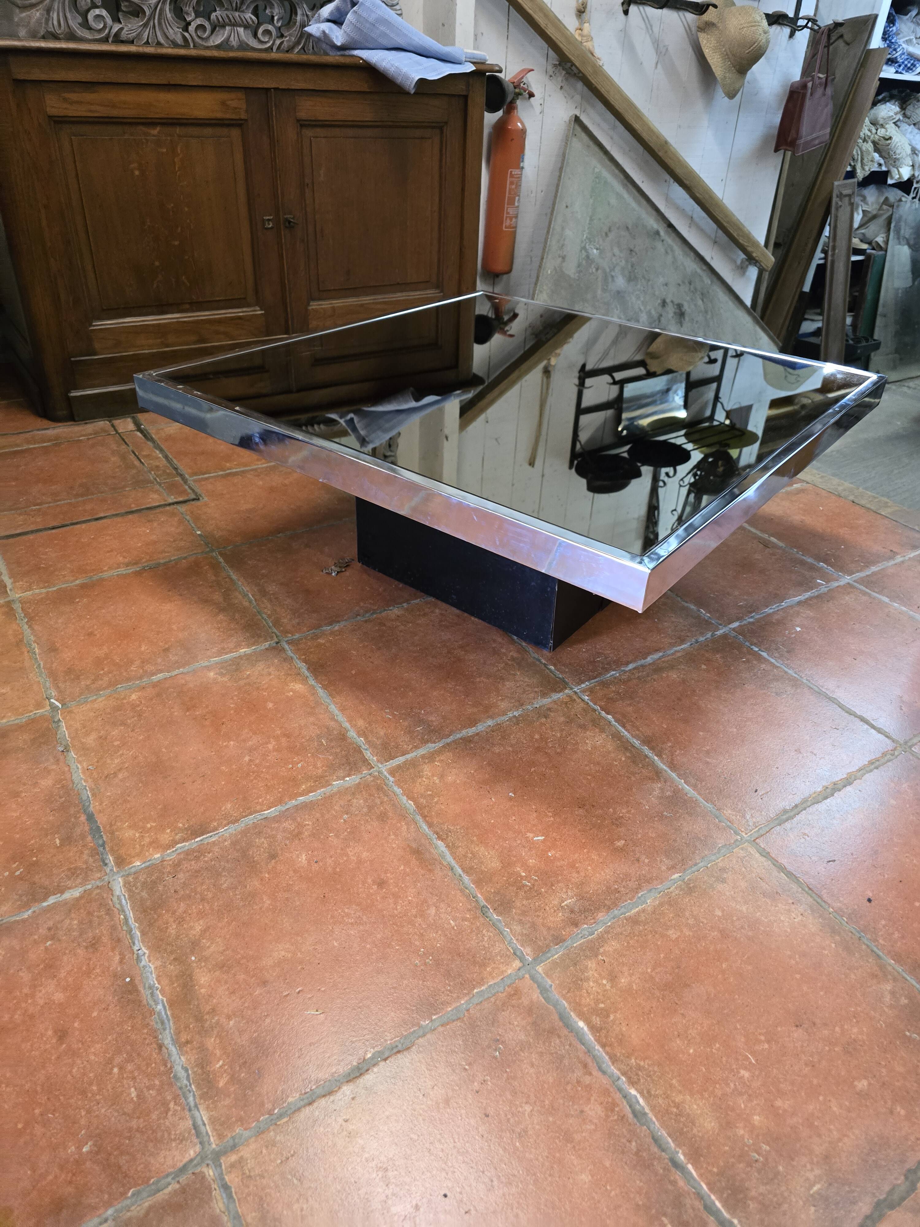 Chrome coffee table with smoked mirror top