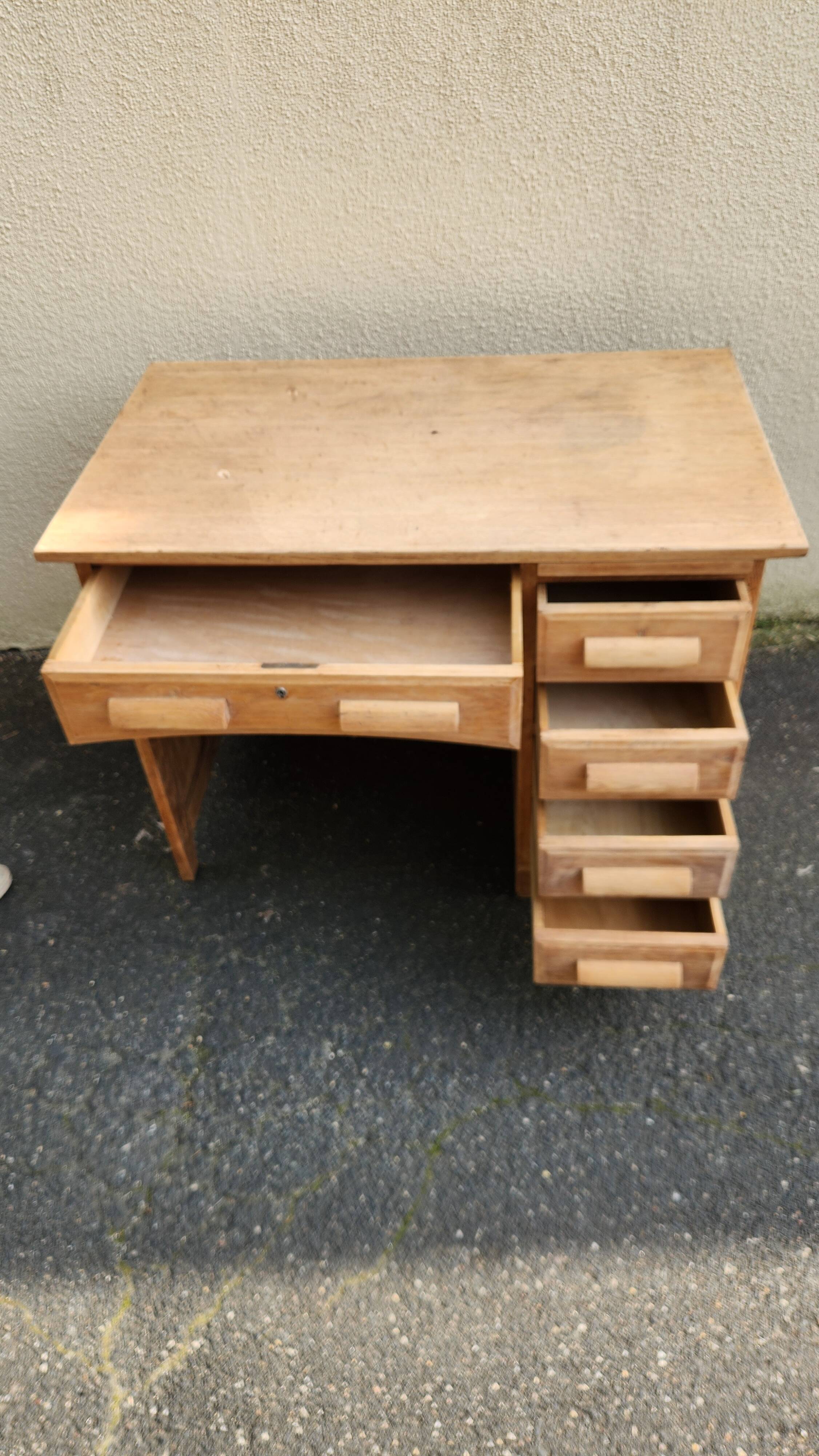 Vintage wooden desk with five drawers from the 1950s-1970s.