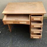 Vintage wooden desk with five drawers from the 1950s-1970s.