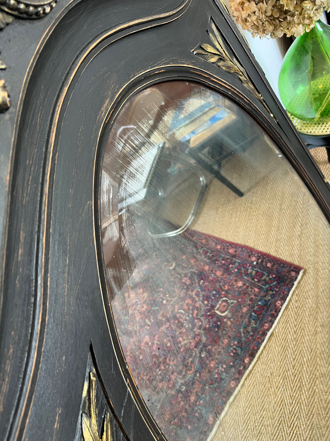 Large old trumeau mirror in black and gilded wood Napoleon style