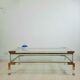 Coffee table with sliding shelf in lucite, brass and glass, Hollywood Regency