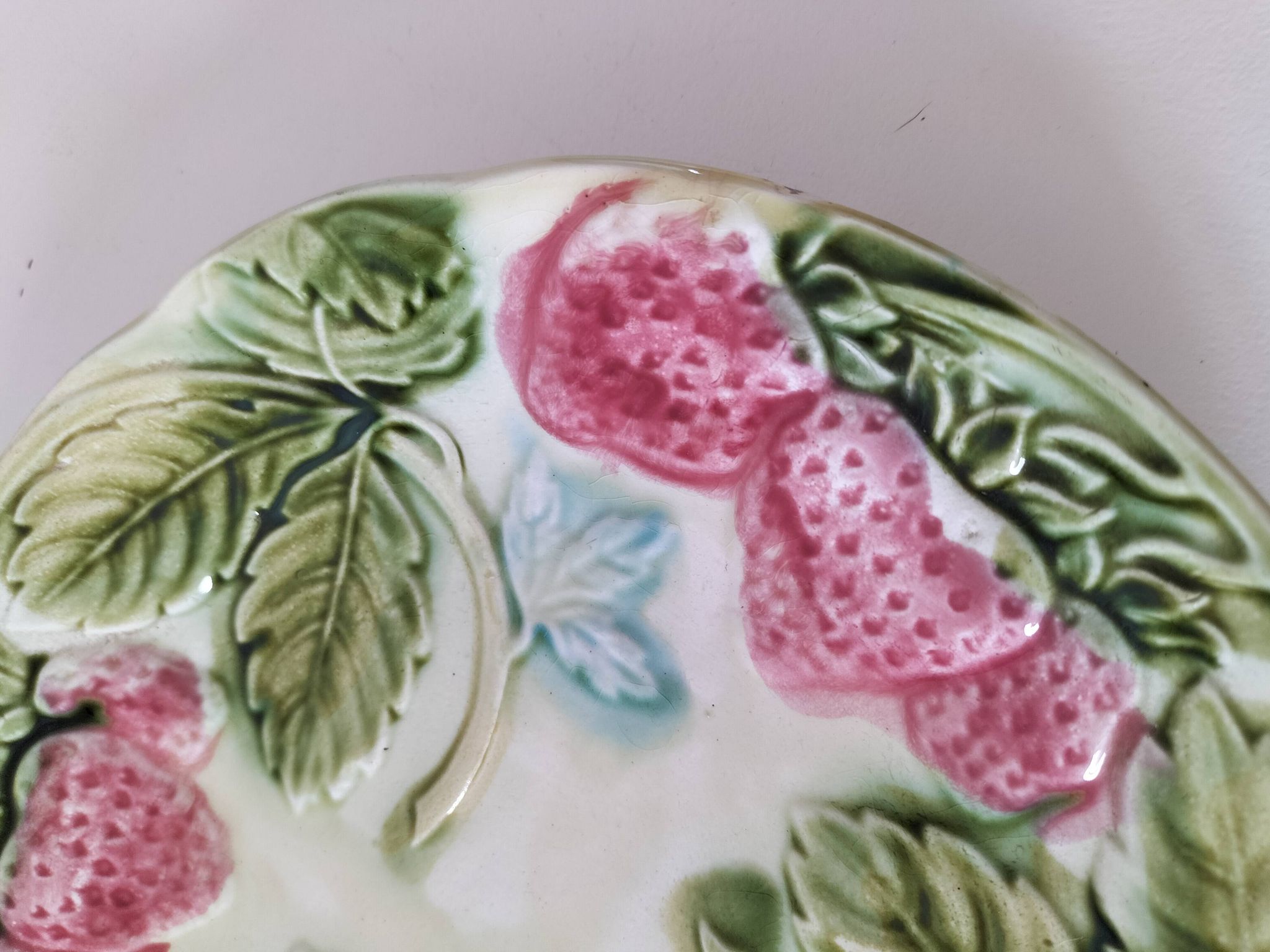 Barbotine plate with strawberries in relief, late 19th and early 20th century