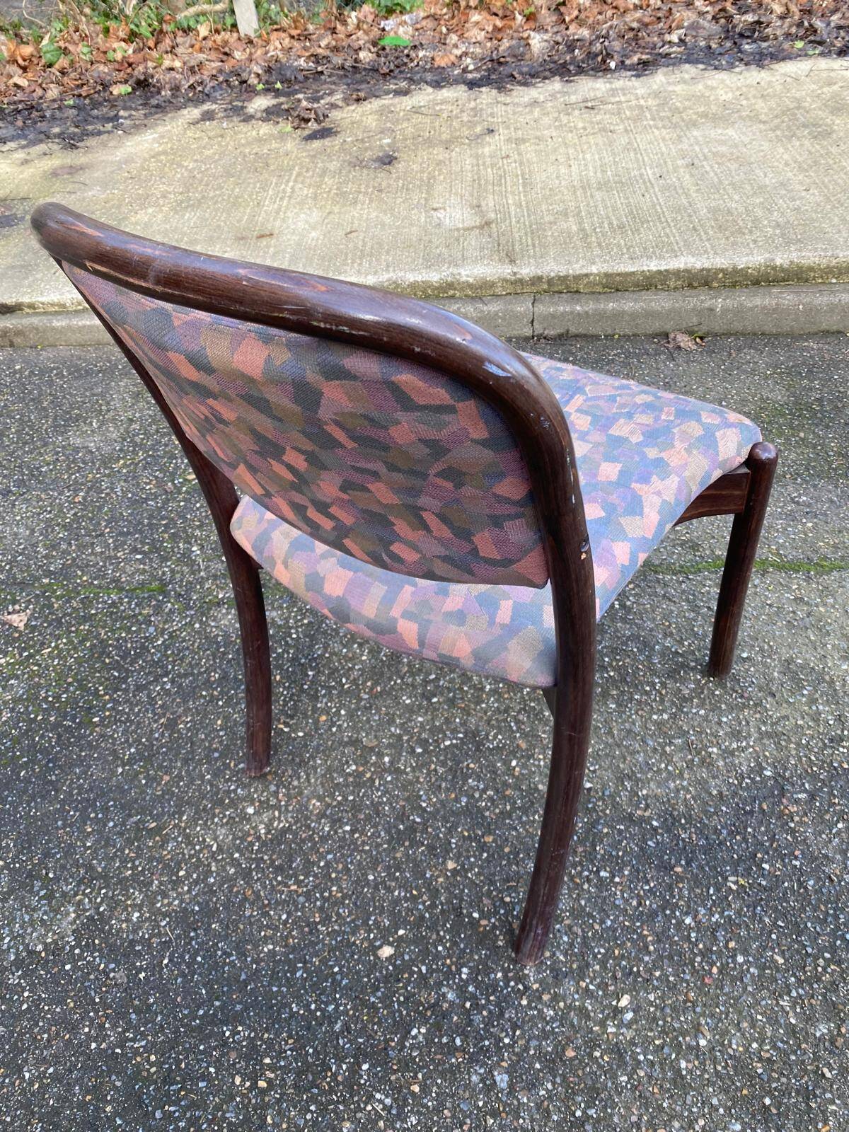 Scandinavian chair in curved solid teak wood and fabric.