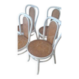 4 white rattan and cane chairs