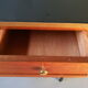 Bureau des années 50/60 en formica noir, acajou, doré